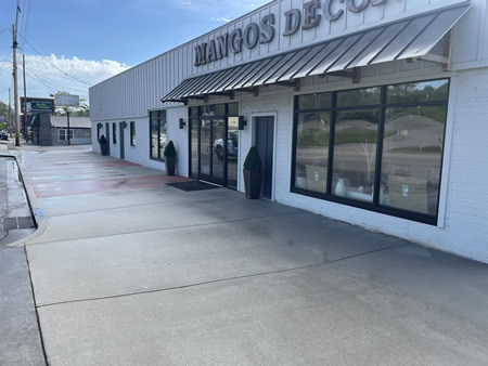 Clean glass-and-metal office building exterior after professional building washing